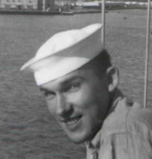 A person in a white hat on a boat

Description automatically generated